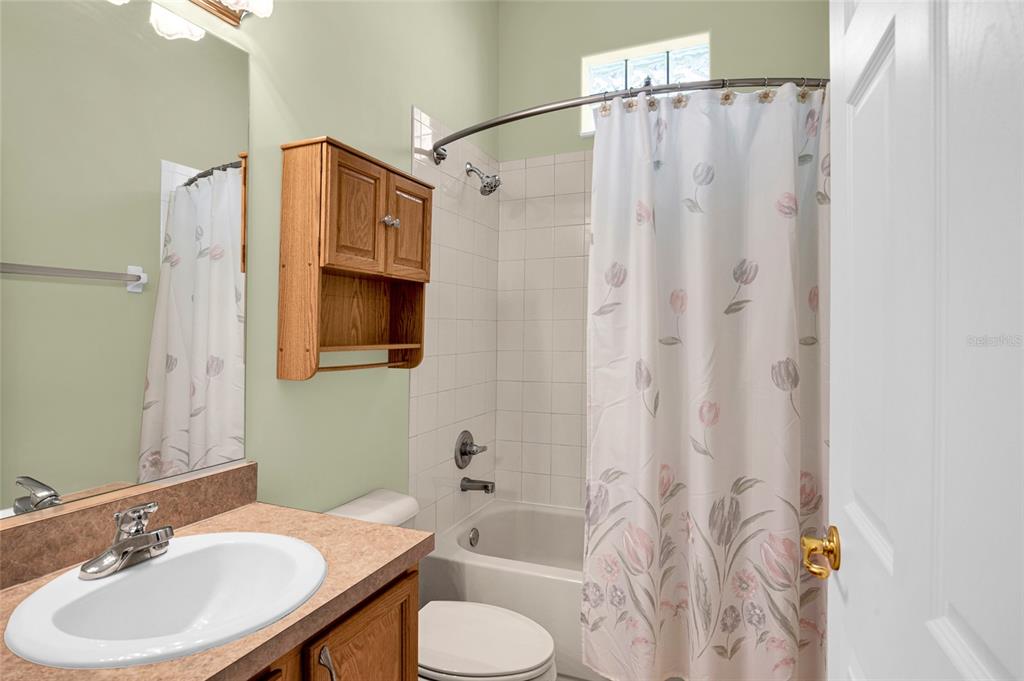 10777 Southwest 71st Circle Ocala, FL 34476 - Photo 35 of 47 a bathroom with a sink toilet and shower