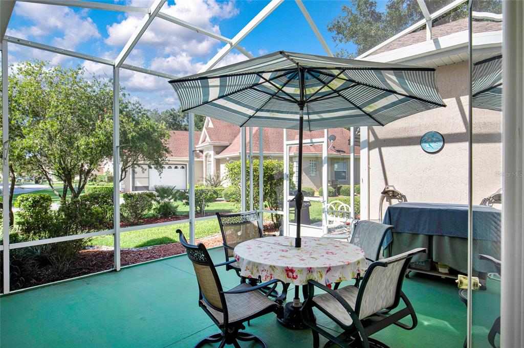 10777 Southwest 71st Circle Ocala, FL 34476 - Photo 41 of 47 a view of an outdoor sitting area with furniture and backyard