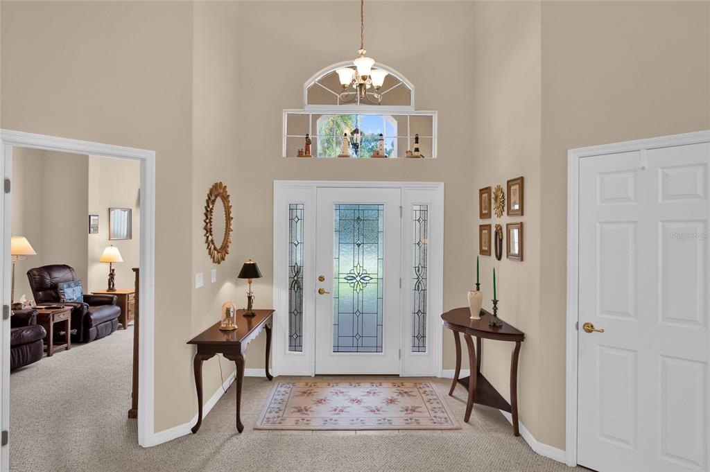 10777 Southwest 71st Circle Ocala, FL 34476 - Photo 9 of 47 a view of a livingroom with furniture and a chandelier