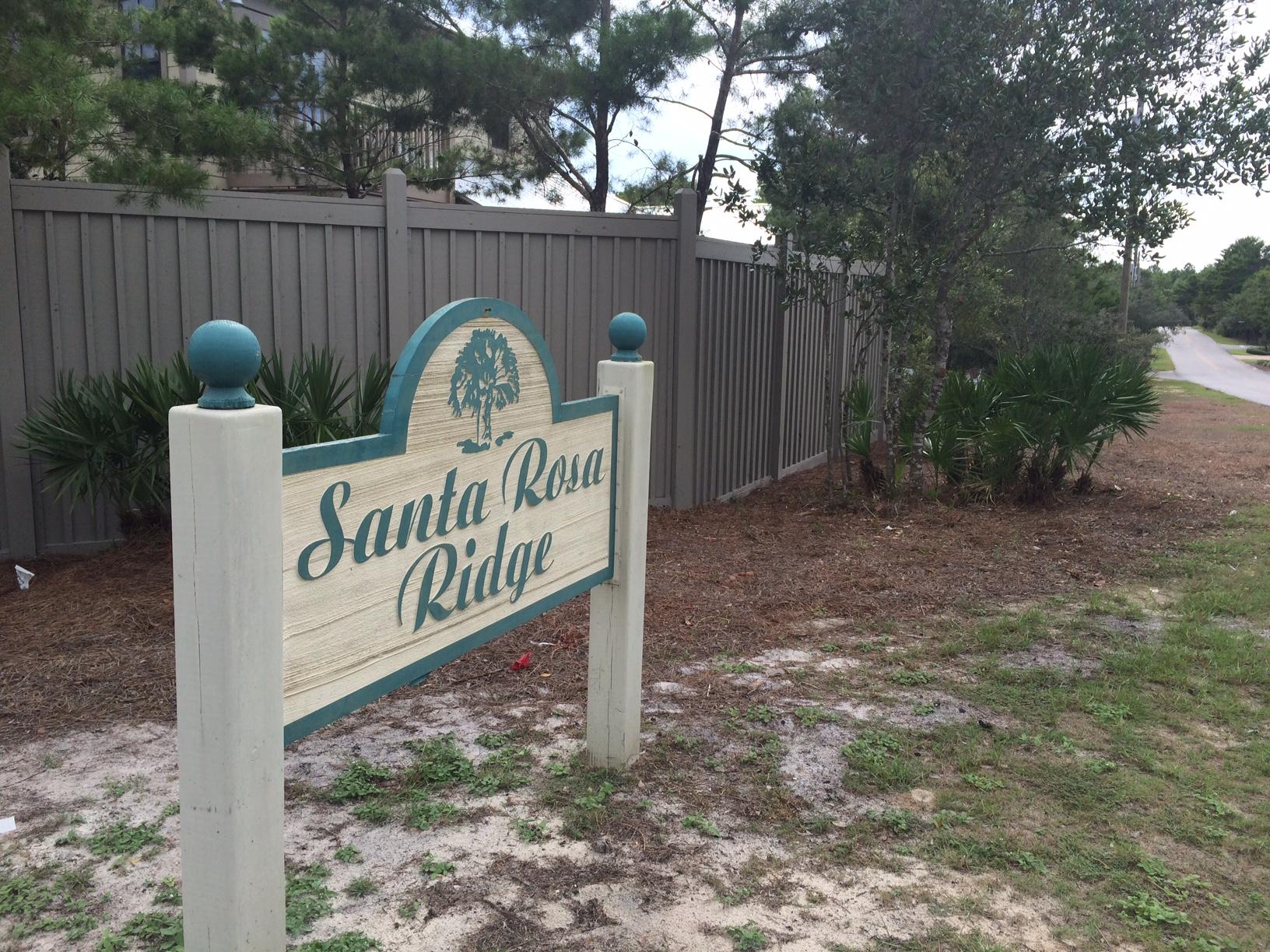Lot 16-bka Lot 16-bka Ridge Road Santa Rosa Beach, FL 32459 - Photo 13 of 18 a view of a wooden fence and a sign board