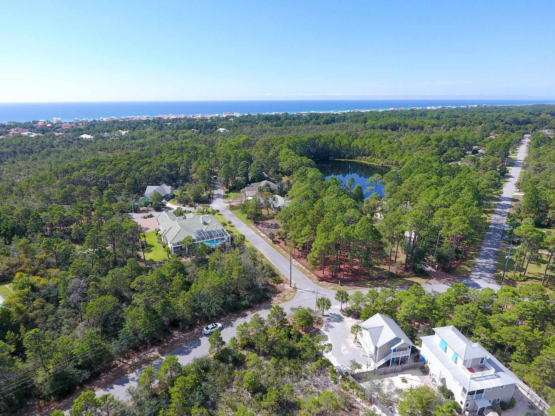 Lot 16-bka Lot 16-bka Ridge Road Santa Rosa Beach, FL 32459 - Photo 3 of 18 an aerial view of a city with lots of residential buildings and mountain view in back