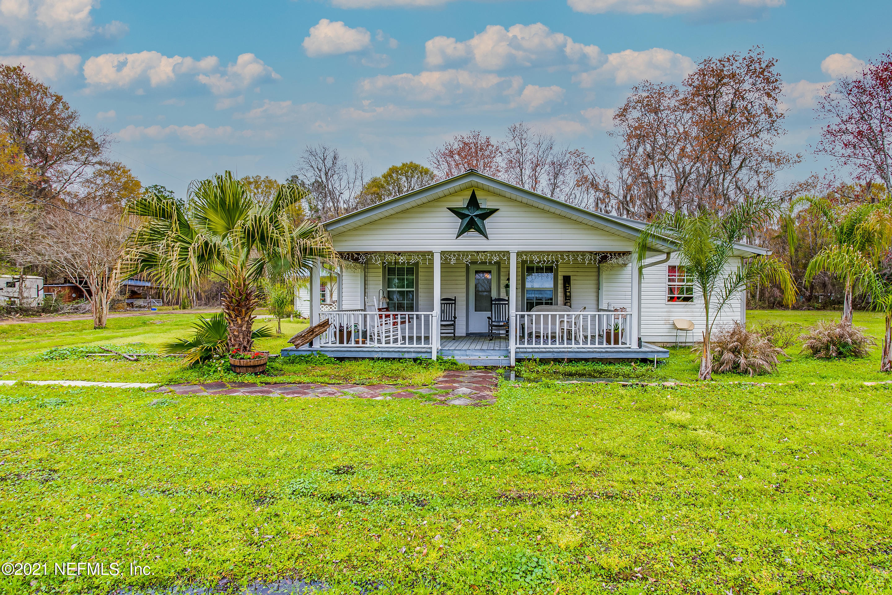 56117 Griffin Road Callahan, FL 32011 - Photo 1 of 30 a view of a house with pool and a yard