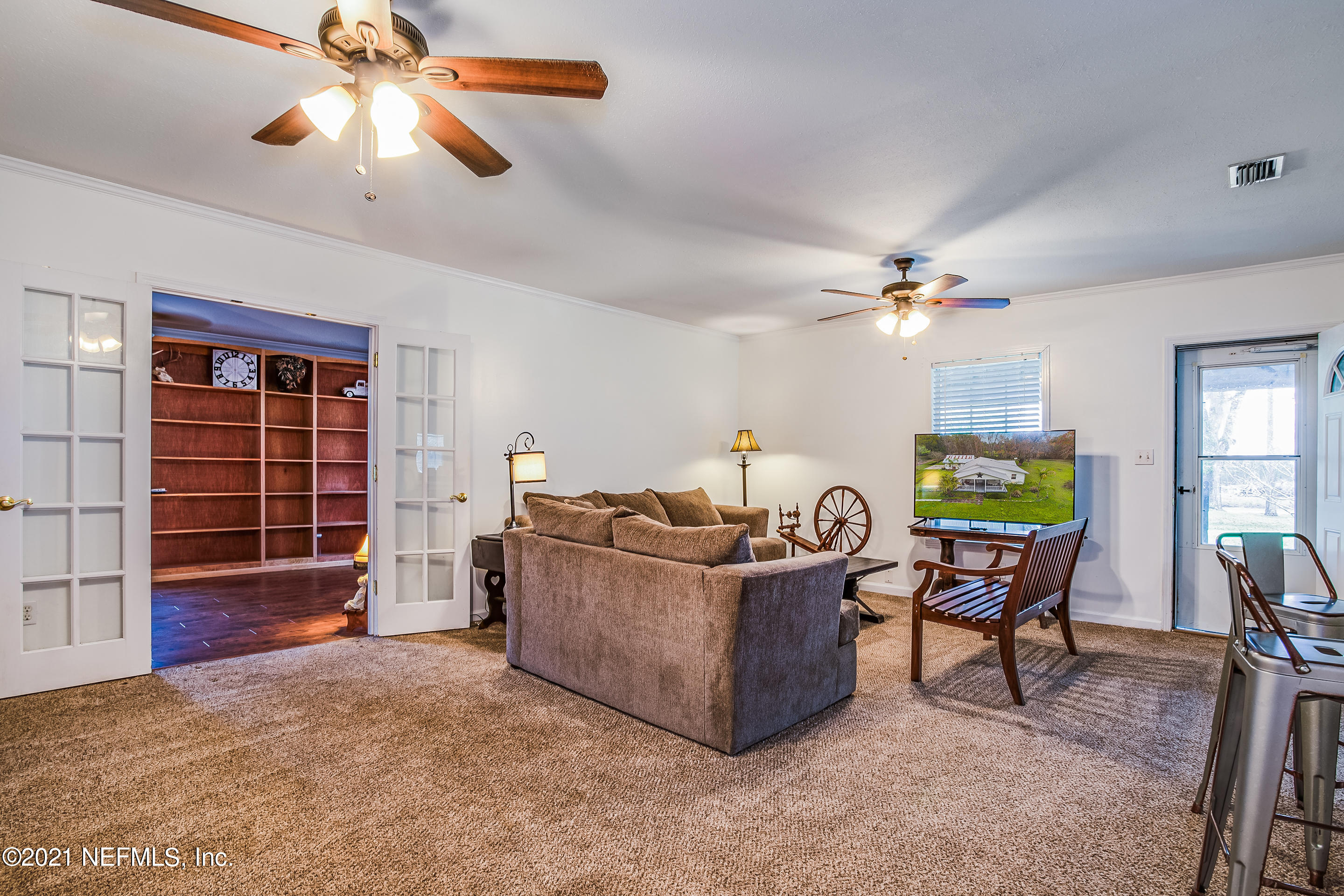 56117 Griffin Road Callahan, FL 32011 - Photo 16 of 30 a living room with furniture and a window