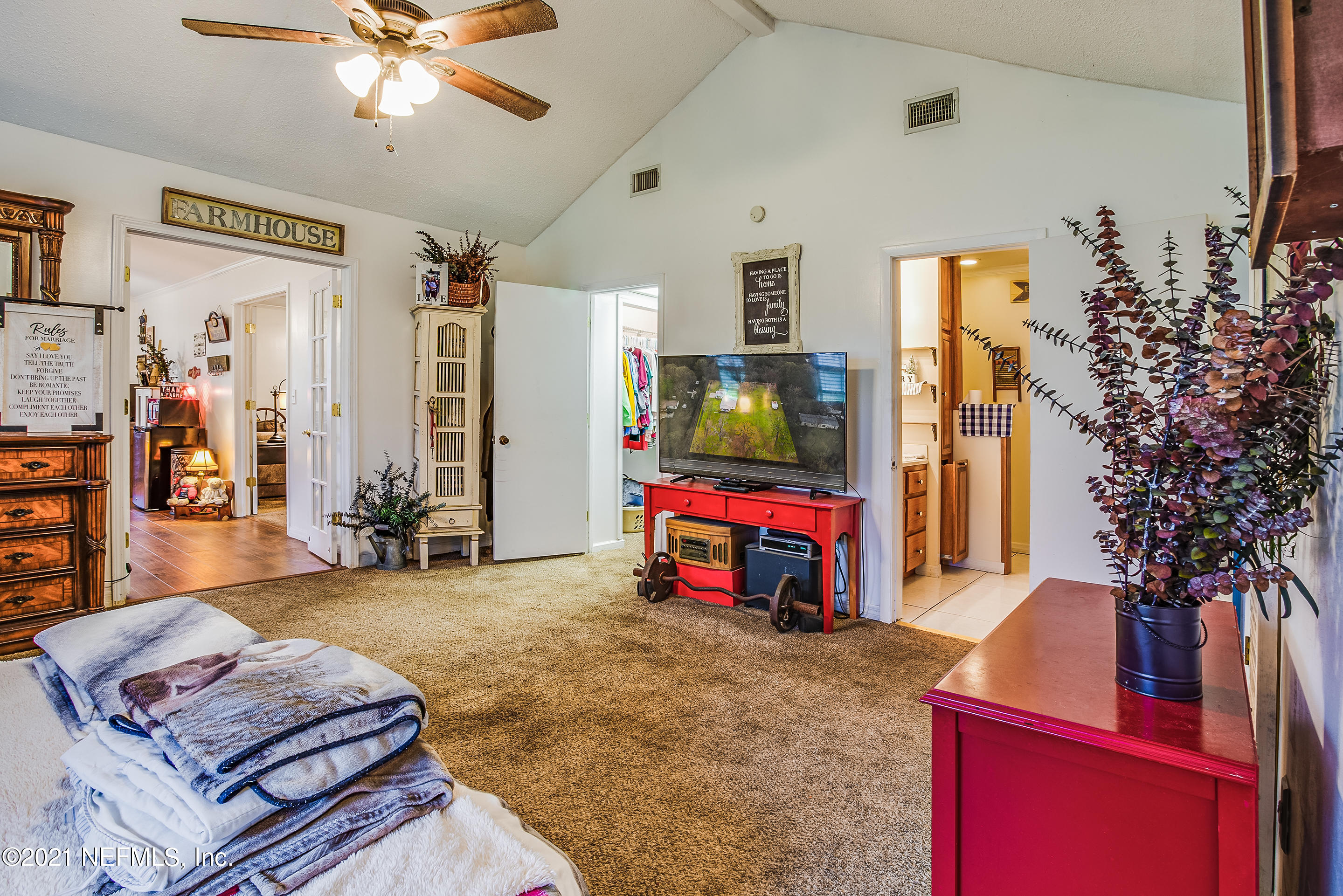 56117 Griffin Road Callahan, FL 32011 - Photo 19 of 30 a living room with furniture and a flat screen tv