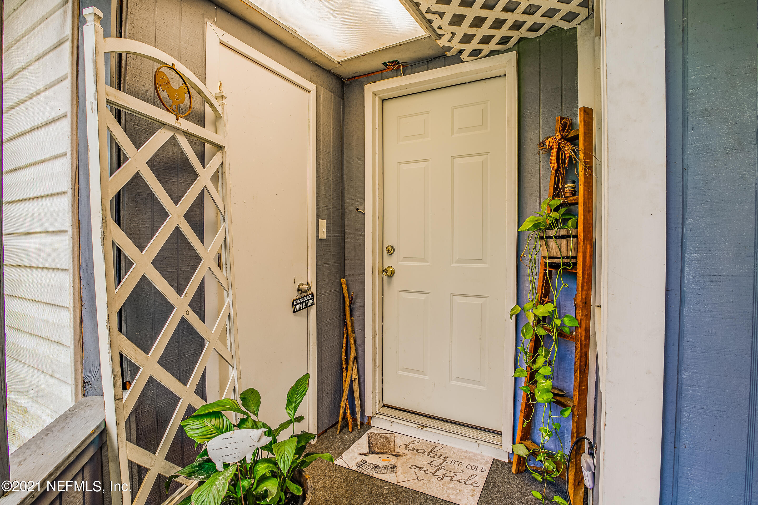 56117 Griffin Road Callahan, FL 32011 - Photo 24 of 30 a door view with a door and a potted plant