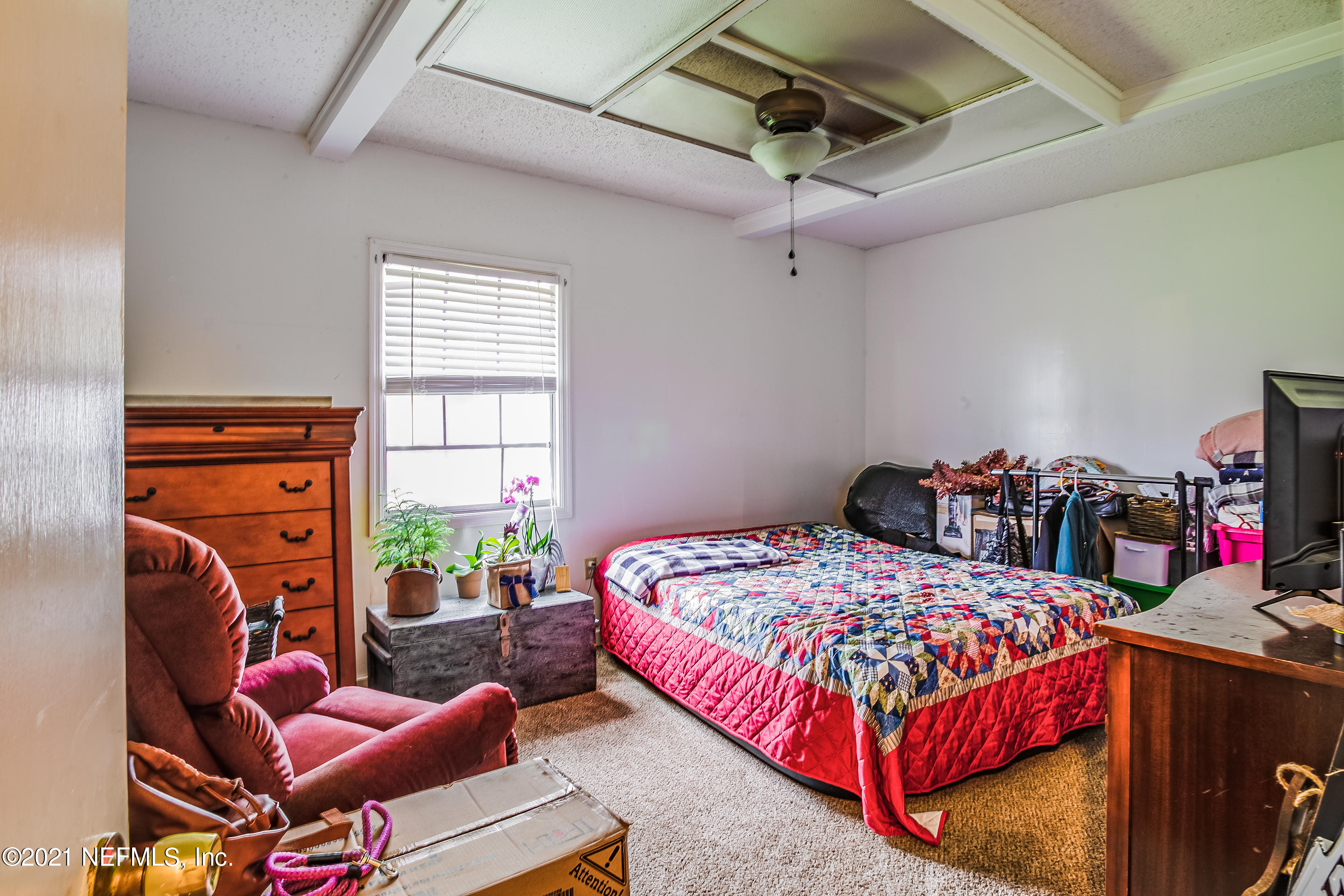 56117 Griffin Road Callahan, FL 32011 - Photo 26 of 30 a bedroom with a bed and a window