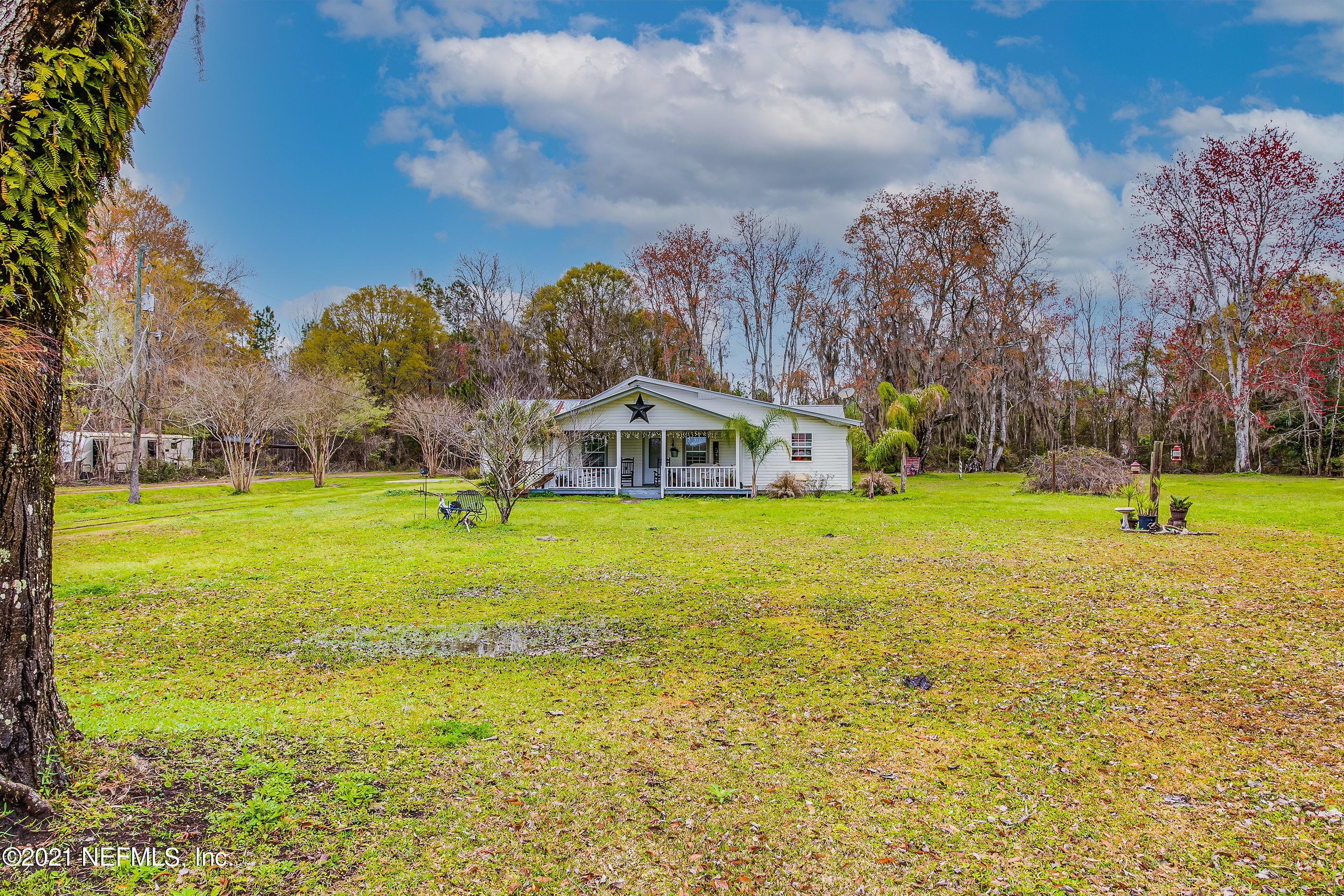 56117 Griffin Road Callahan, FL 32011 - Photo 6 of 30 a house view with swimming pool in front of it