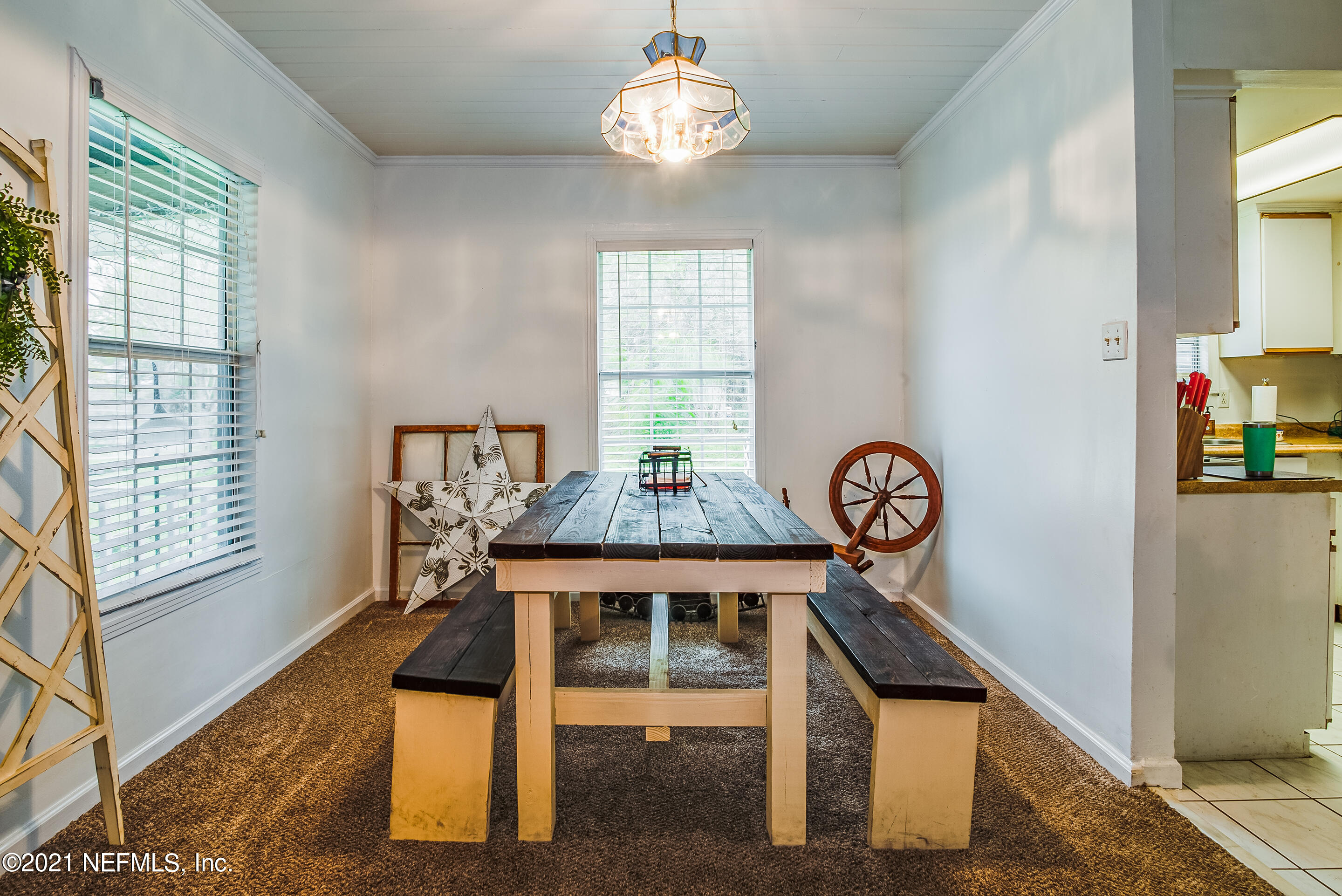 56117 Griffin Road Callahan, FL 32011 - Photo 9 of 30 a view of a dining room with furniture window and wooden floor