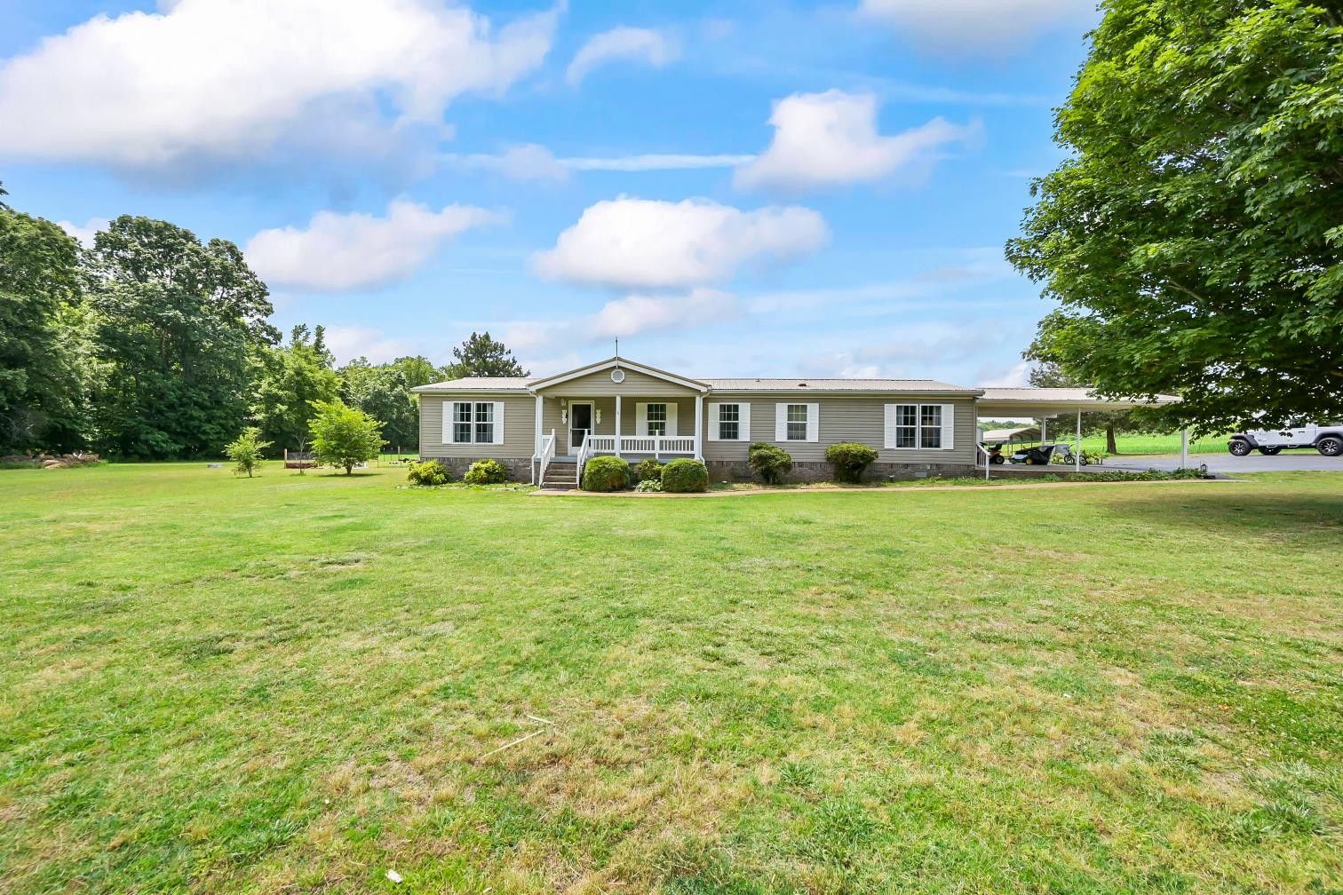 6439 Cedar Grove Road Big Sandy, TN 38221 - Photo 28 of 38 a view of house with a yard