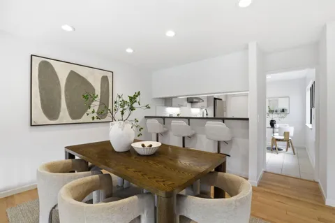 a kitchen with stainless steel appliances granite countertop a sink and cabinets