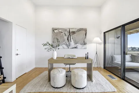 a bedroom with a bed and a couch