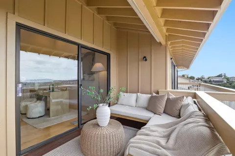 a bed room with a bed and a large window