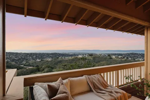 a view of balcony with furniture