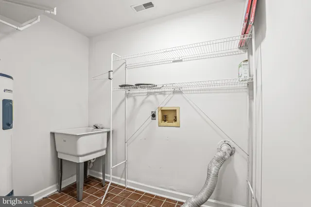 a bathroom with a shower and a sink
