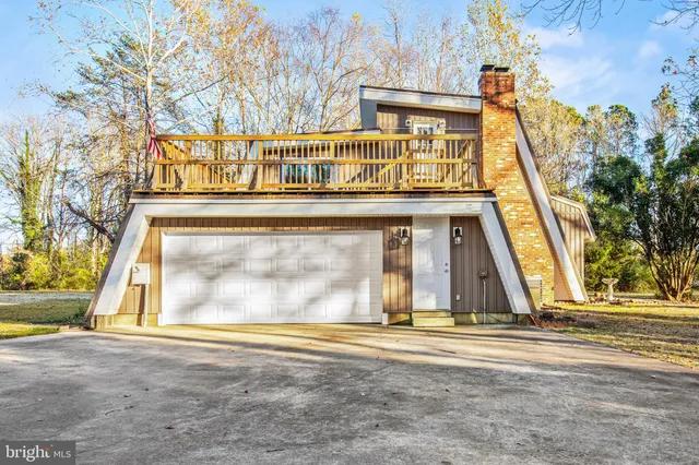 a view of a brick house with large windows
