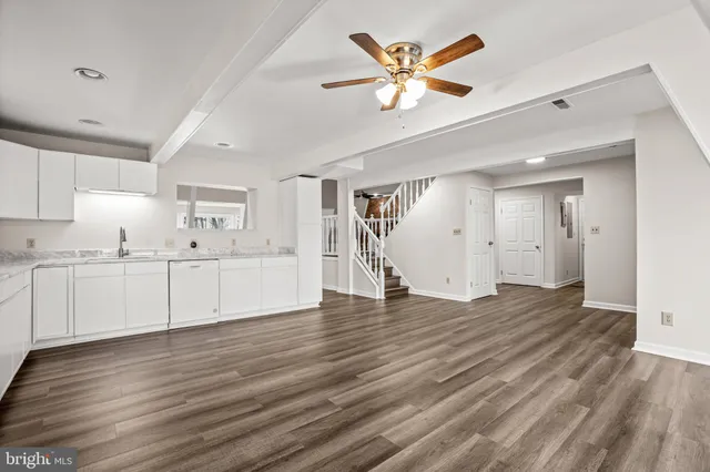 a view of a kitchen with wooden floor