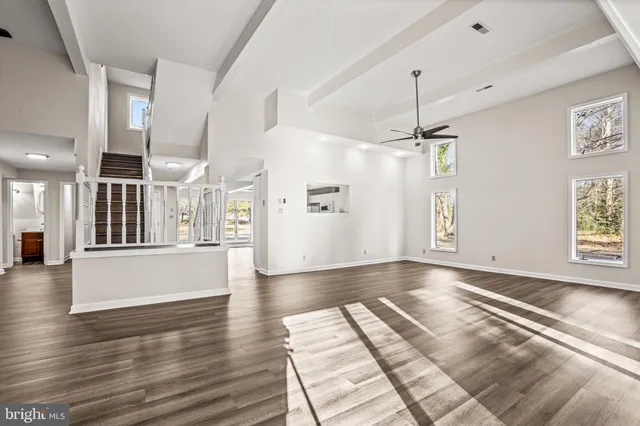 a view of an entryway with wooden floor