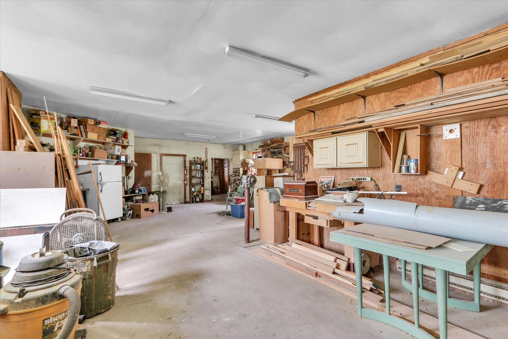 4904 North Cunningham Avenue Urbana, IL 61802 - Photo 11 of 15 a room with lots of wooden furniture and a large window
