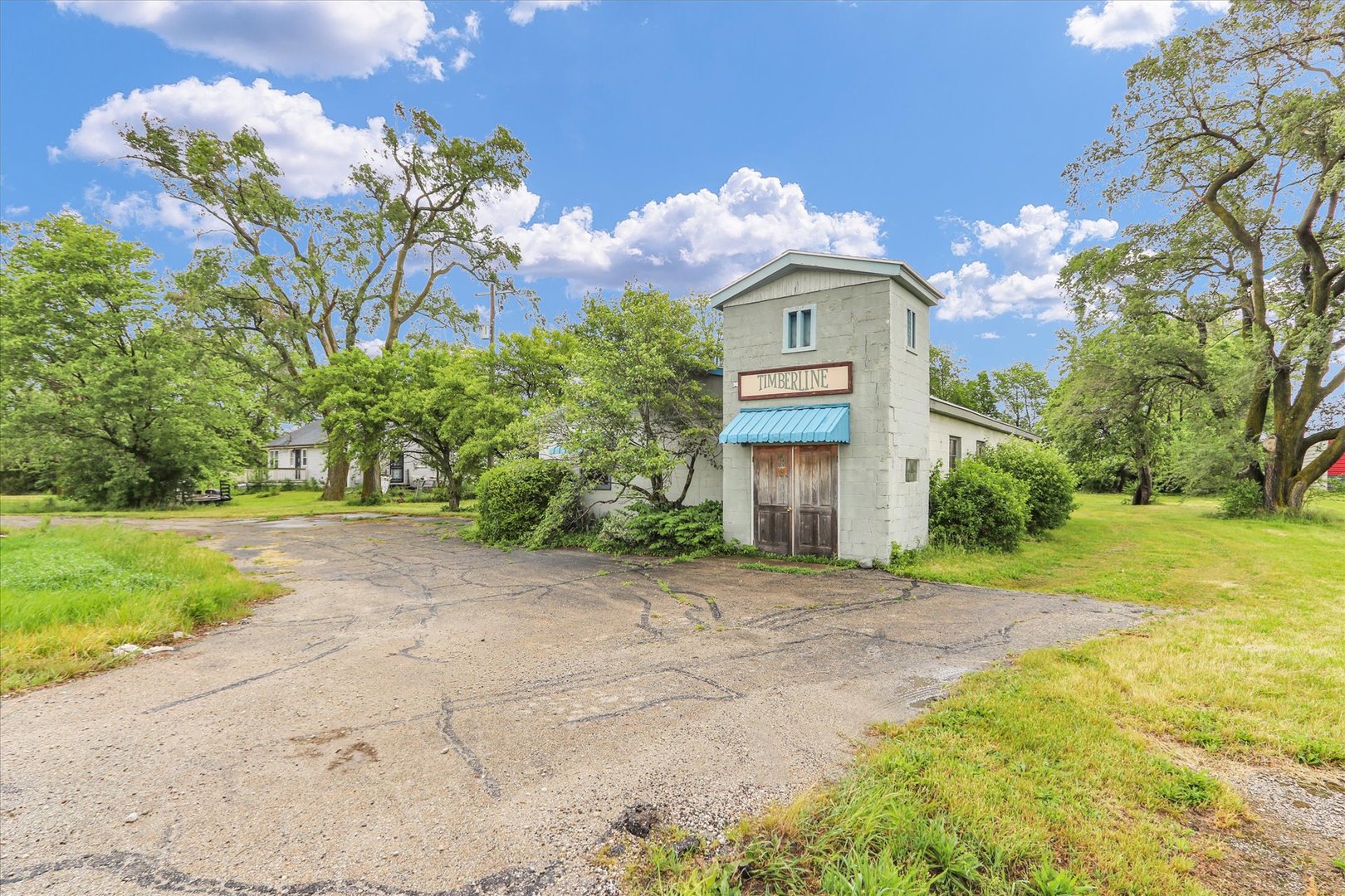 4904 North Cunningham Avenue Urbana, IL 61802 - Photo 2 of 15 a front view of a house with a yard and garage