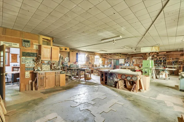 a view of a patio with dining table and chairs