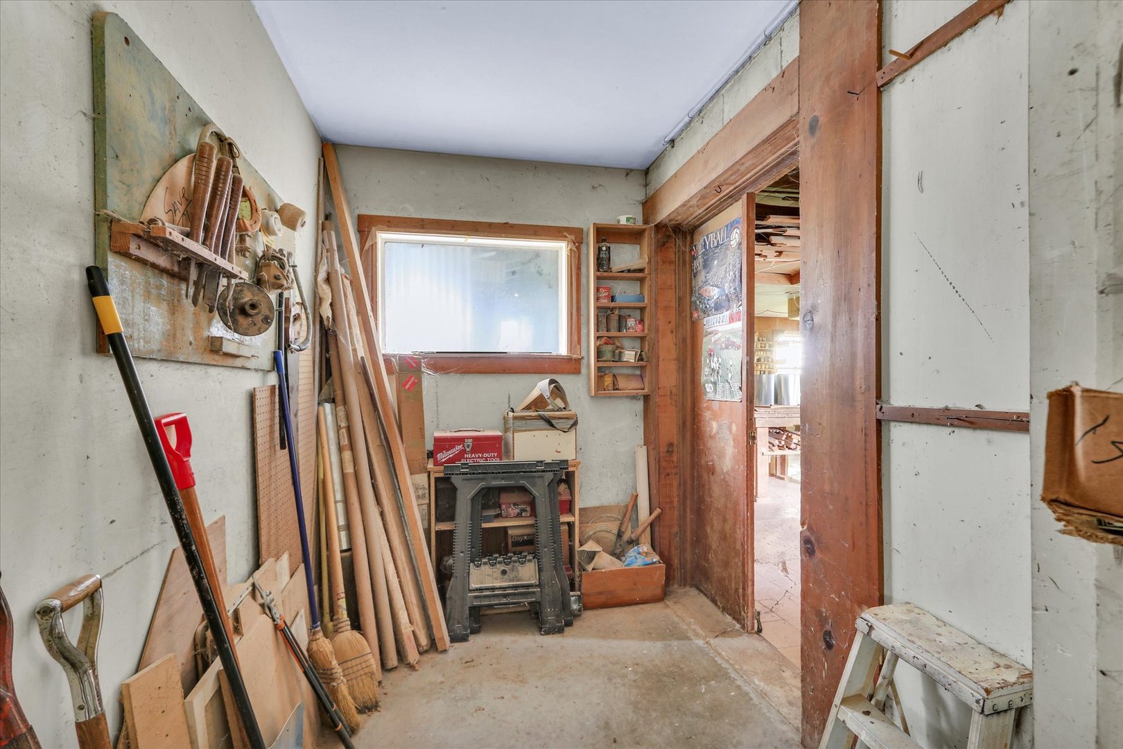 4904 North Cunningham Avenue Urbana, IL 61802 - Photo 7 of 15 a view of a livingroom with furniture and a flat screen tv