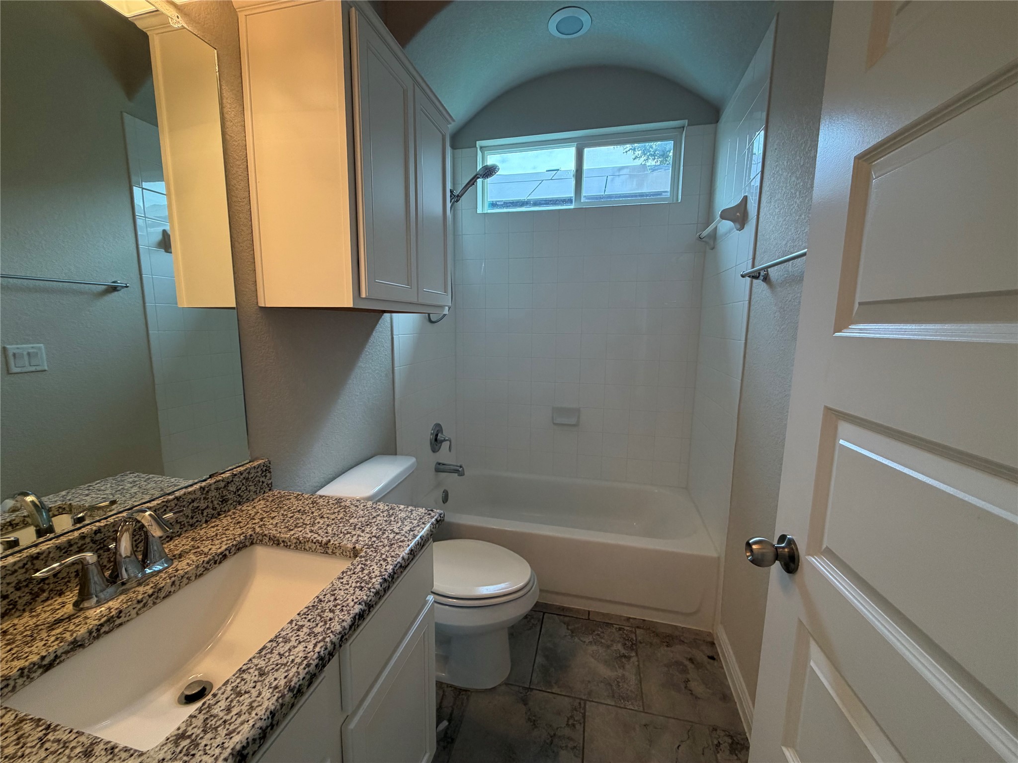 419 Gettysburg Loop Elgin, TX 78621 - Photo 16 of 21 Granite counters and tiled flooring outfit this well-appointed bathroom.