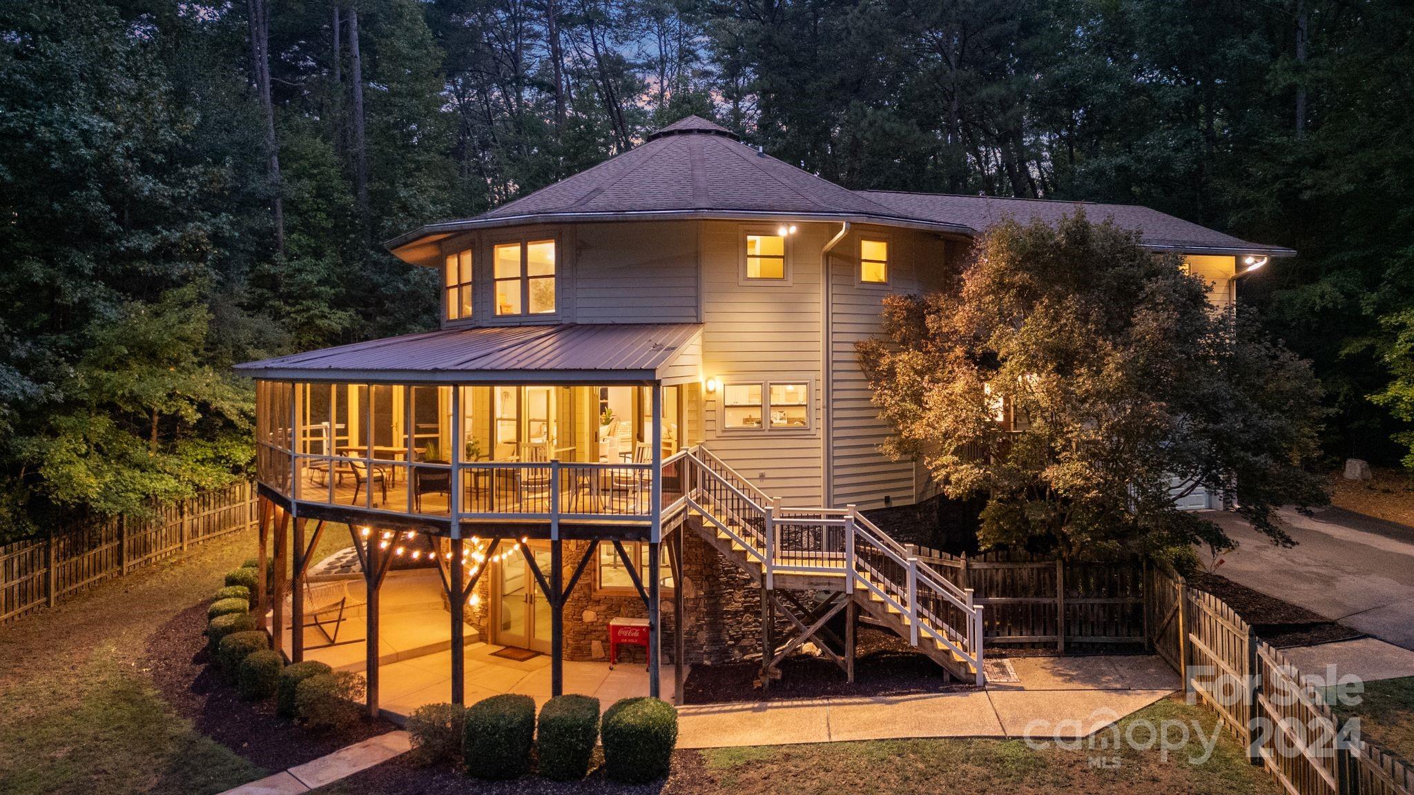 22947 Lake Tillery Road Albemarle, NC 28001 - Photo 3 of 42 a front view of a house with a yard