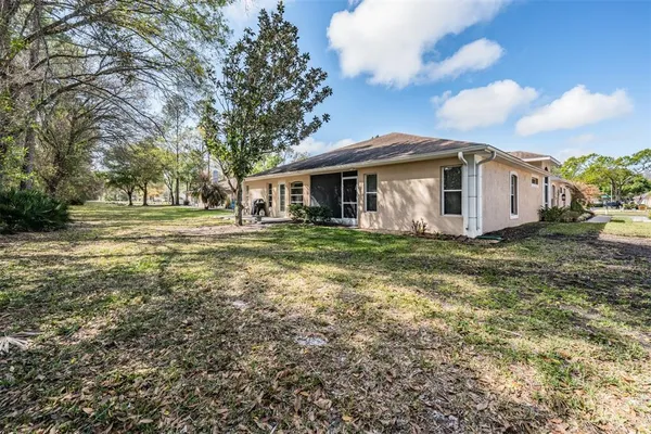 a view of a house with a yard