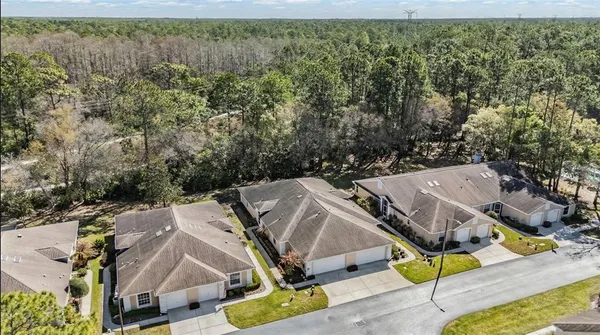 an aerial view of residential house with outdoor space