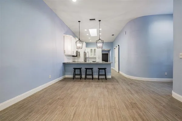 a room with furniture and a wooden floor