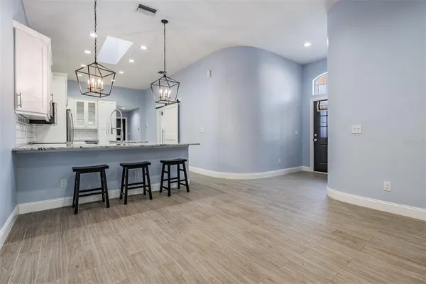 a view of a kitchen and dining room
