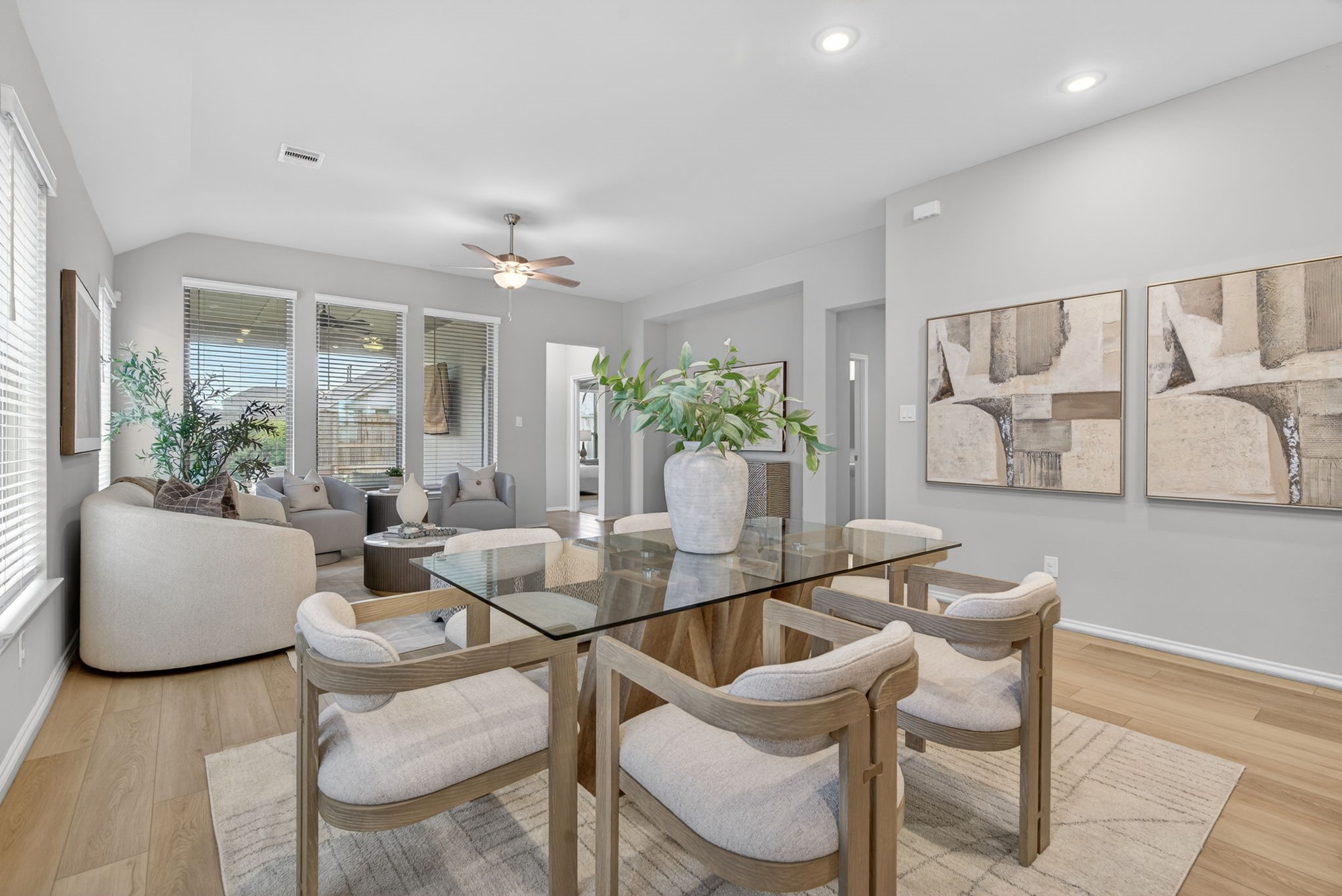 31731 Redbud Blossom Lane Spring, TX 77386 - Photo 12 of 38 This photo showcases a modern open-concept dining and living area. Large windows throughout this area for natural light.