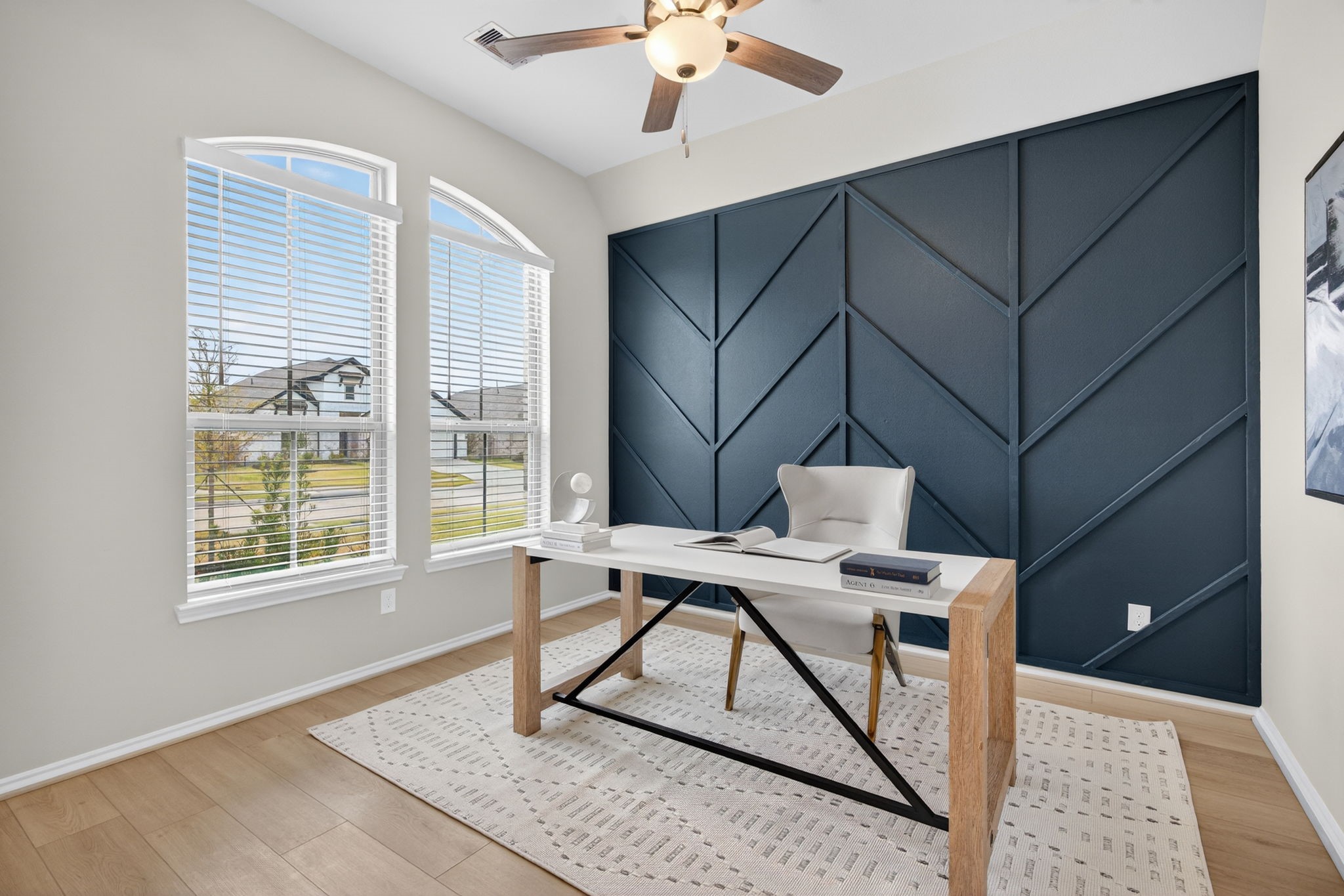 31731 Redbud Blossom Lane Spring, TX 77386 - Photo 6 of 38 Bright home office featuring a stylish geometric accent wall, a large windows, allowing an abundance of natural light to flow through the home.