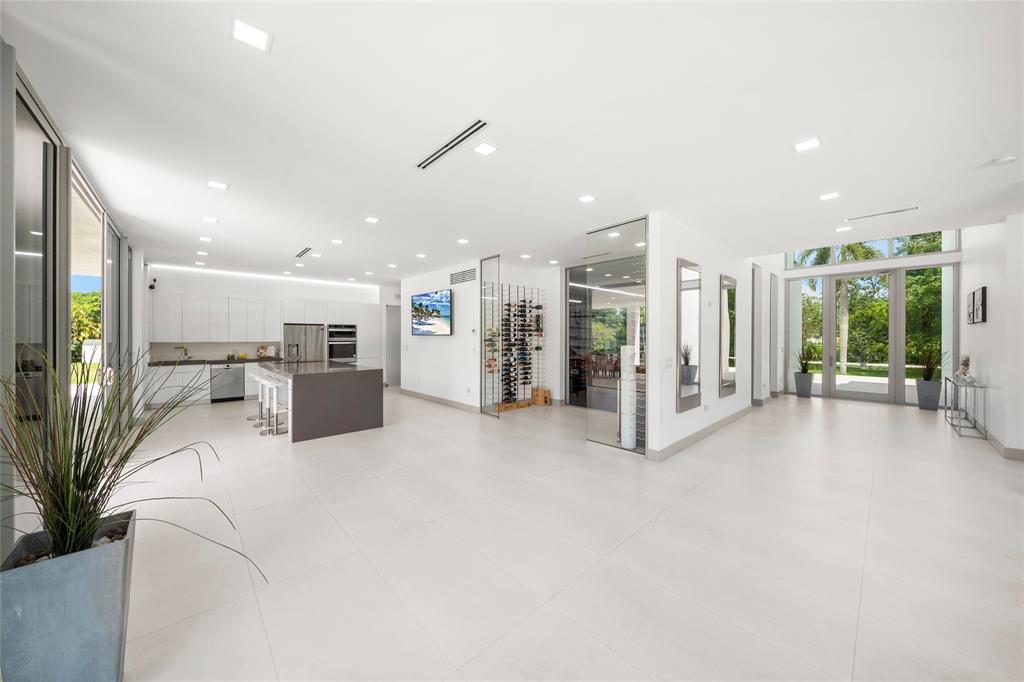 17250 Southwest 52nd Court Southwest Ranches, FL 33331 - Photo 15 of 62 a view of a livingroom with furniture and a kitchen