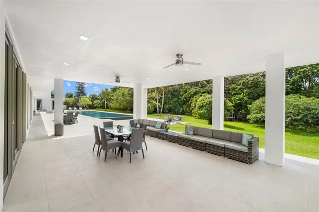 a view of swimming pool with seating space