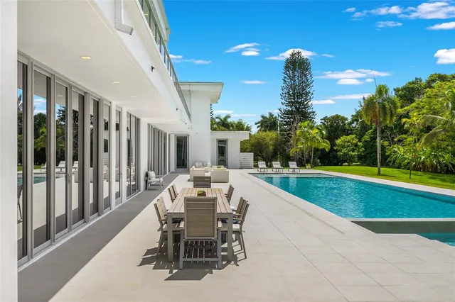 a view of a swimming pool with a lounge chair