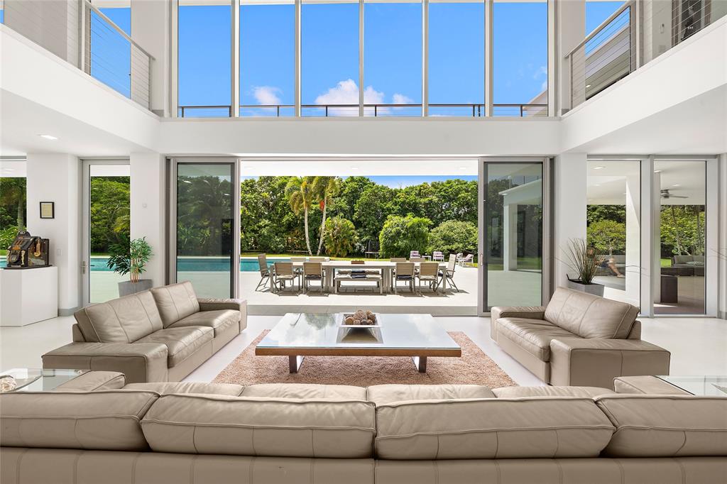 17250 Southwest 52nd Court Southwest Ranches, FL 33331 - Photo 21 of 62 a living room with furniture and a large window