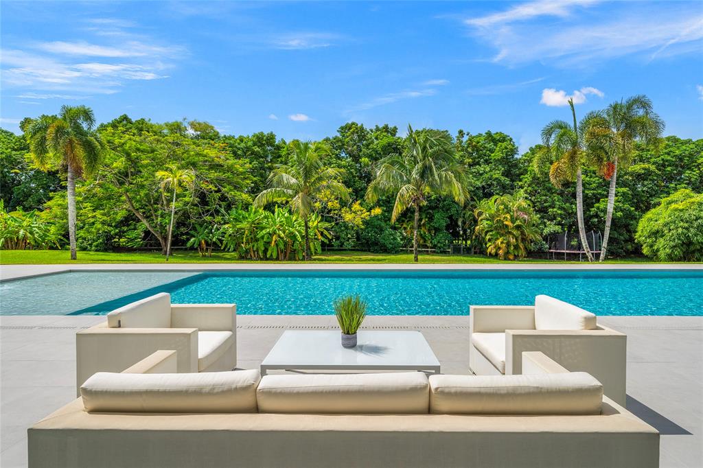 17250 Southwest 52nd Court Southwest Ranches, FL 33331 - Photo 22 of 62 a view of swimming pool with seating space