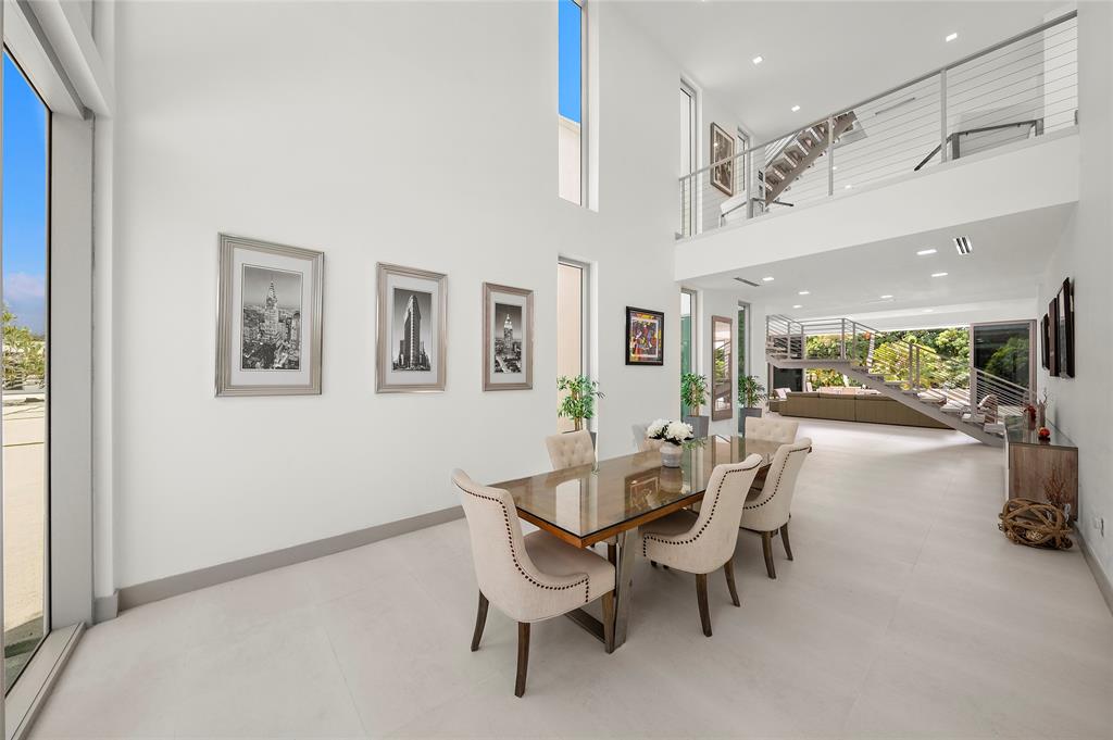 17250 Southwest 52nd Court Southwest Ranches, FL 33331 - Photo 26 of 62 a dining room with furniture and a floor to ceiling window