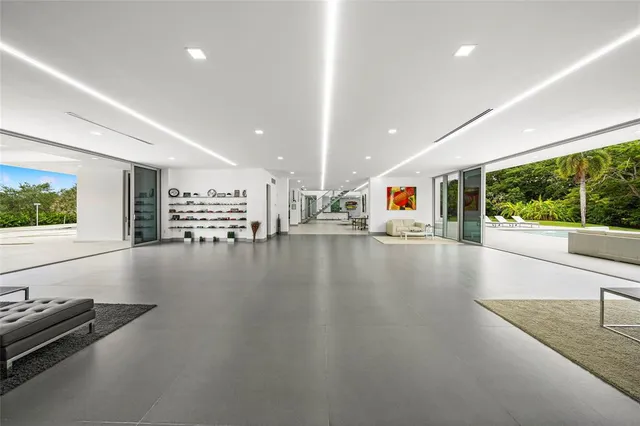 a living room with stainless steel appliances kitchen island granite countertop furniture and a view of living room