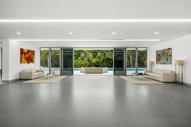 a room with table tennis air hockey table and arcade game machine