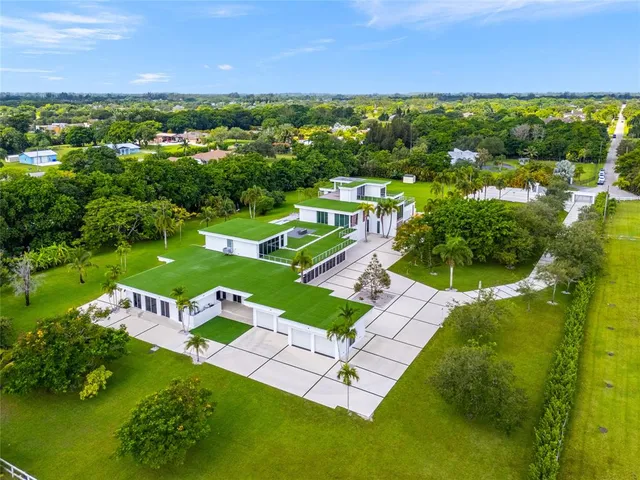 an aerial view of a house with a garden