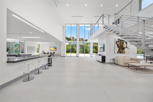 a bathroom with a granite countertop sink mirror vanity and toilet