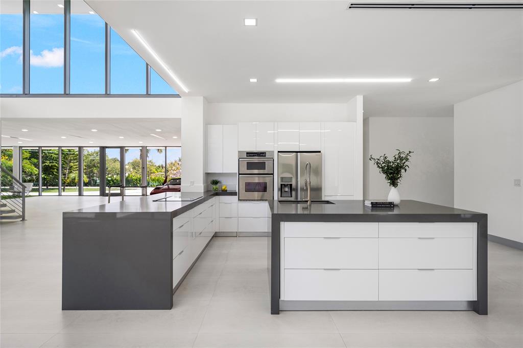 17250 Southwest 52nd Court Southwest Ranches, FL 33331 - Photo 36 of 62 a living room with stainless steel appliances kitchen island granite countertop furniture and a view of living room