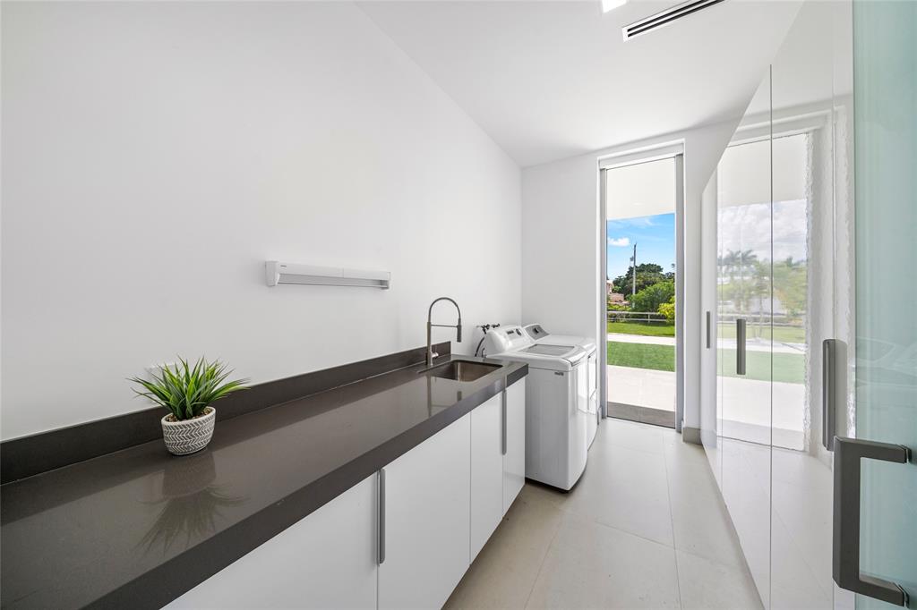 17250 Southwest 52nd Court Southwest Ranches, FL 33331 - Photo 43 of 62 a kitchen with a sink and refrigerator