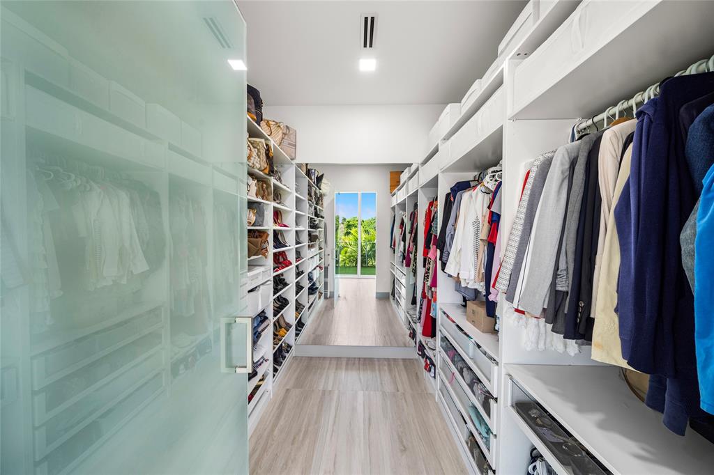17250 Southwest 52nd Court Southwest Ranches, FL 33331 - Photo 48 of 62 a view of walk in closet with clothes
