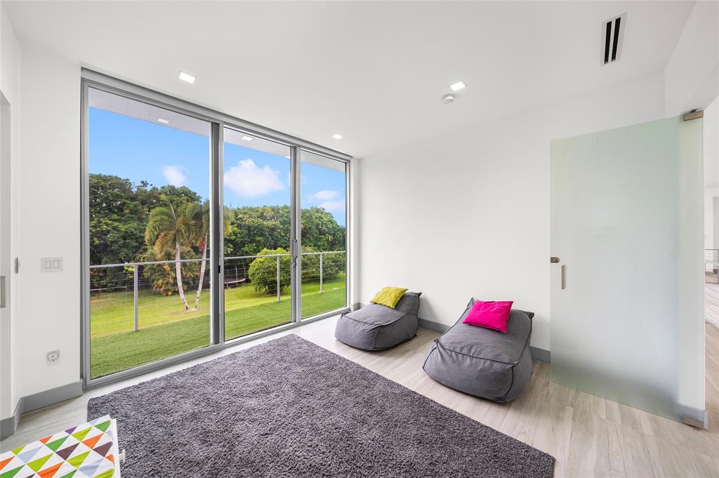 17250 Southwest 52nd Court Southwest Ranches, FL 33331 - Photo 53 of 62 a room with toys and a couch