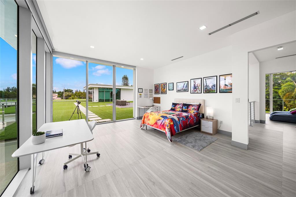 17250 Southwest 52nd Court Southwest Ranches, FL 33331 - Photo 54 of 62 a bedroom with furniture and a large window