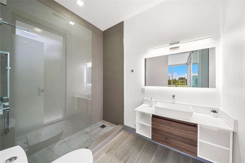 17250 Southwest 52nd Court Southwest Ranches, FL 33331 - Photo 55 of 62 a bathroom with a sink and mirror