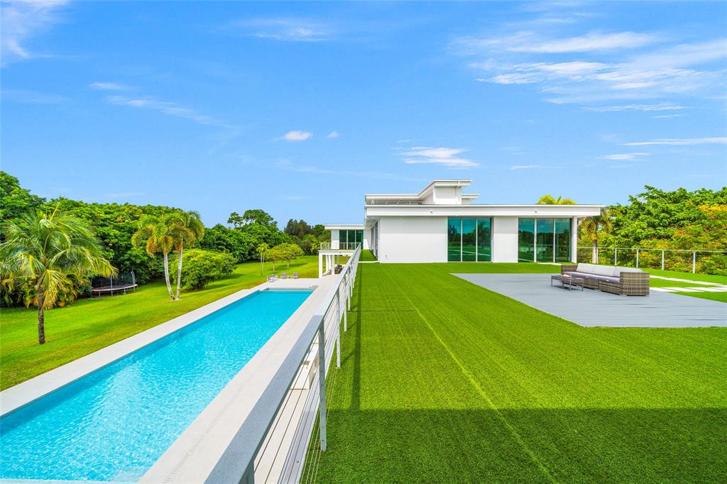 17250 Southwest 52nd Court Southwest Ranches, FL 33331 - Photo 57 of 62 a view of an house with swimming pool yard and outdoor seating